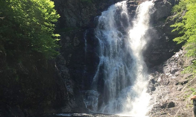 A large waterfall on a sunny day