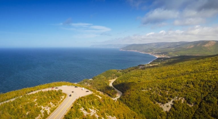 Aerial view of a highway that winds through an ocean coastline